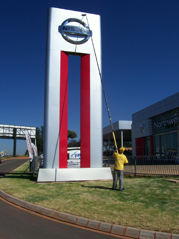 Cleaning pylon sign for Nissan